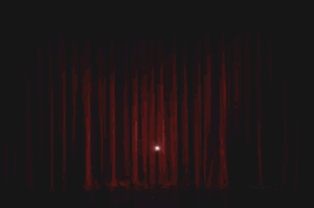 a stage with a microphone on it and a lot of lights