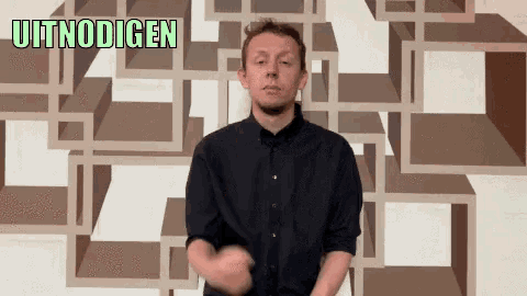 a man stands in front of a wall with the words uitnodigen on it