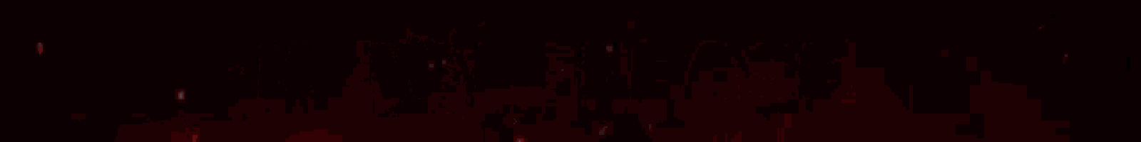 a red light is shining on a black background