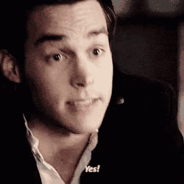 a close up of a man 's face with the words `` yes '' written on his face .