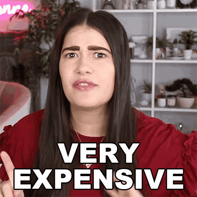 a woman in a red shirt says very expensive in white letters