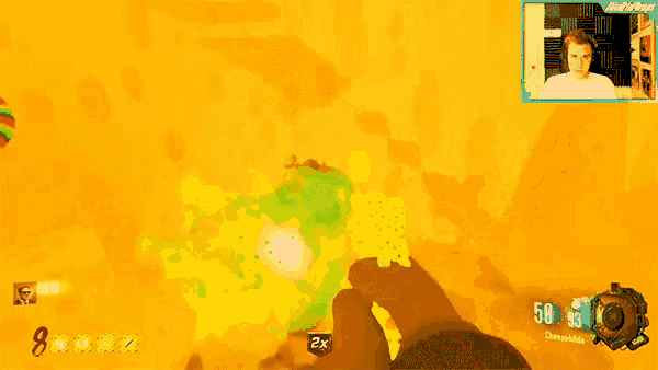 a video game is being played with a man in the background and the number 48 is visible on the screen