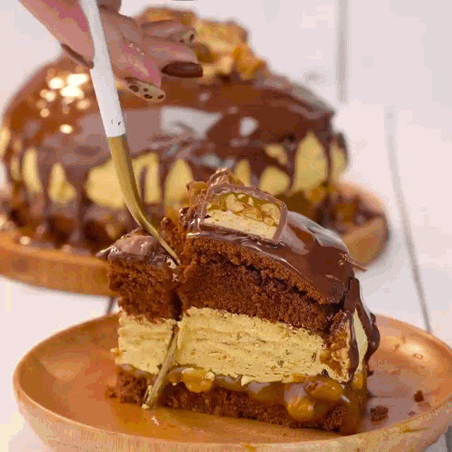 a person is cutting a piece of cake with a knife