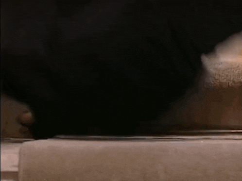 a person is walking down a set of stairs in a house