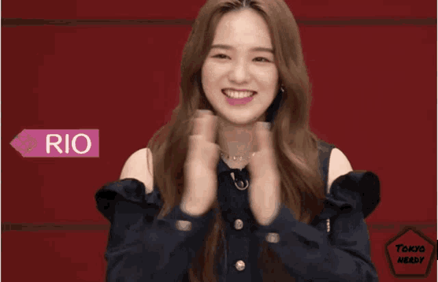 a girl with long hair is making a peace sign with her hands