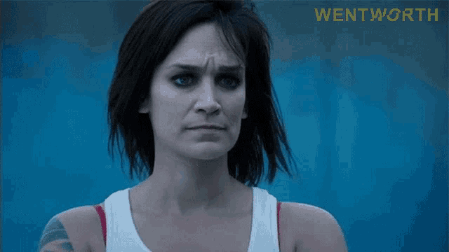 a close up of a woman 's face with the word wentworth on the bottom right