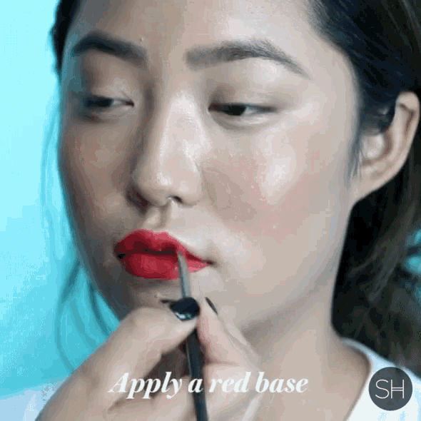 a woman is applying red lipstick with the words apply a red base above her