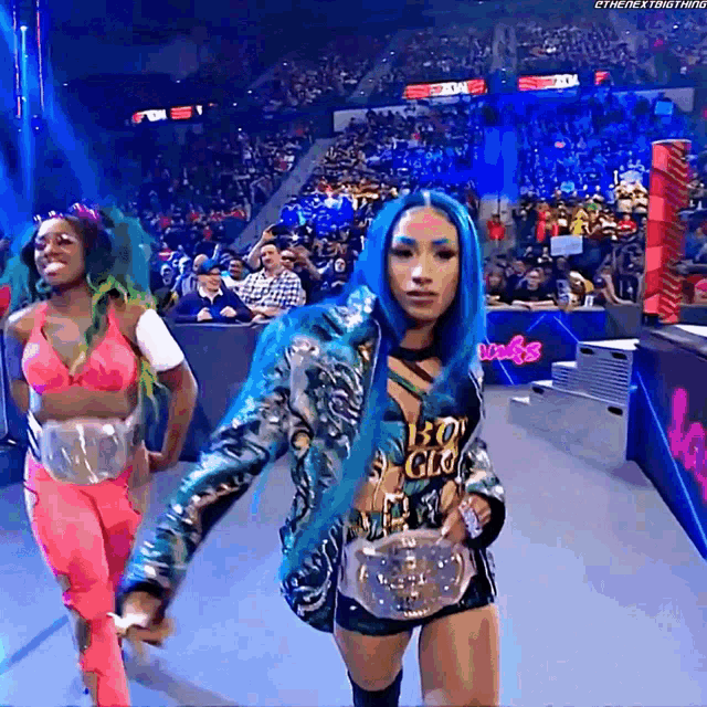 a woman with blue hair and a shirt that says boy glory