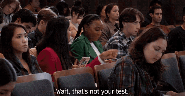 a woman in a green jacket says wait that 's not your test in front of another woman