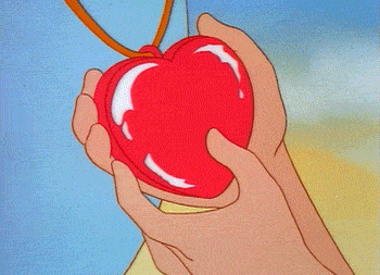 a cartoon character is holding a red heart shaped object