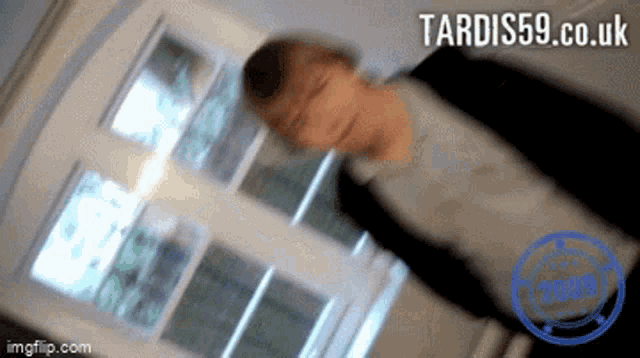 a blurry picture of a person with tardis59.co.uk written on the bottom right