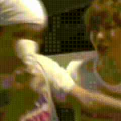 a blurry picture of a person holding another person 's arm
