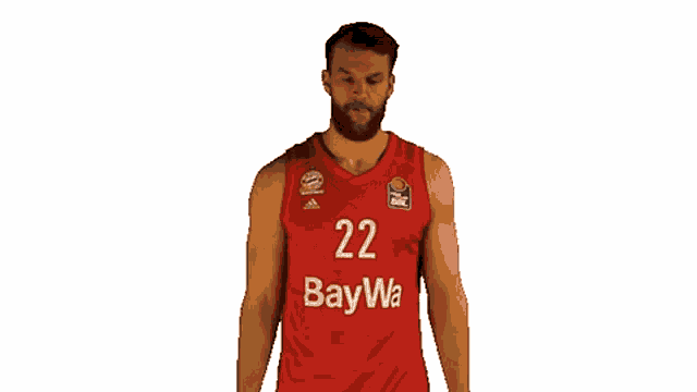 a basketball player wearing a red jersey with the number 22 on it .
