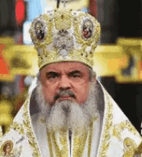 a man with a beard wearing a white robe and a gold crown .