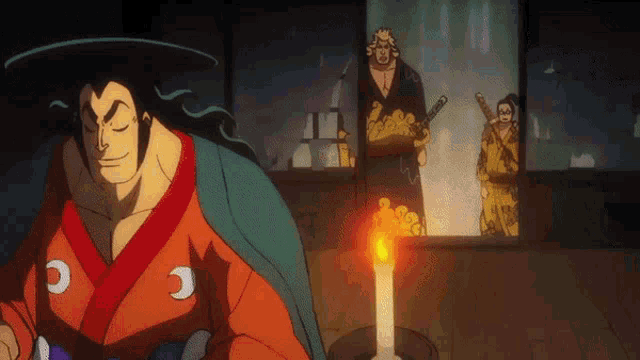 a man in a kimono is standing next to a candle