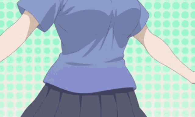 a girl in a blue shirt and black skirt stands in front of a polka dot background