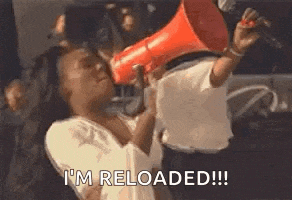 a woman is holding a megaphone in her hand and saying `` i 'm reload ! ''