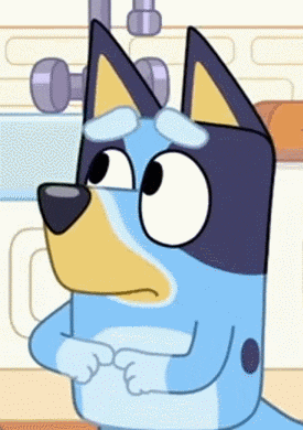 a blue and yellow cartoon dog with a sad look on his face .