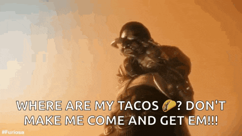 a man is holding a taco and says where are my tacos
