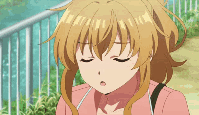a girl with her eyes closed is wearing a pink jacket