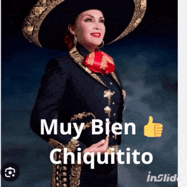 a woman wearing a mariachi outfit is giving a thumbs up sign