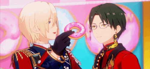 a couple of anime characters are standing next to each other and one of them is holding a donut .