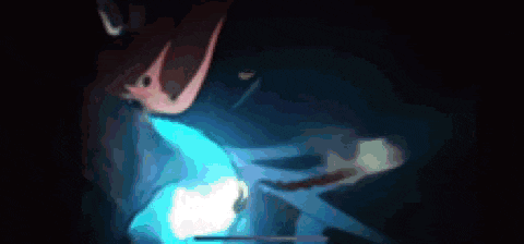 a close up of a person 's face with a blue light coming out of it