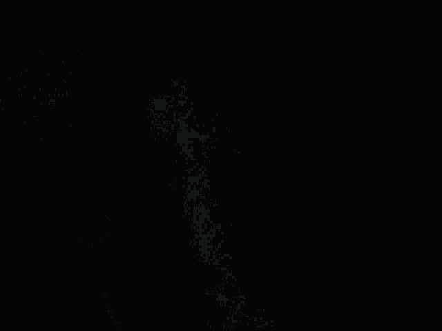 a person is standing in the dark with a light shining on them