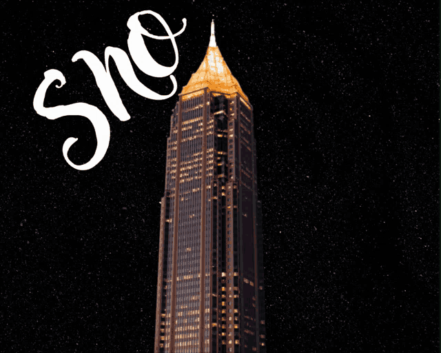 a very tall building with the word sno written above it