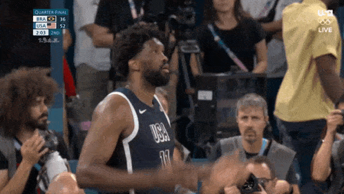 a basketball player wearing a jersey that says usa