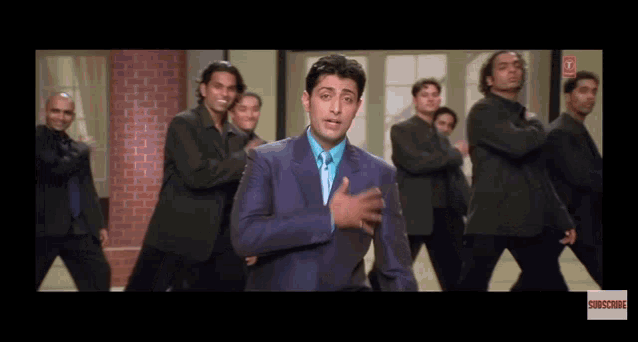 a man in a suit and tie is surrounded by a group of men in suits