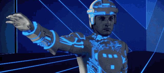 a man in a futuristic outfit with the letter t on the chest