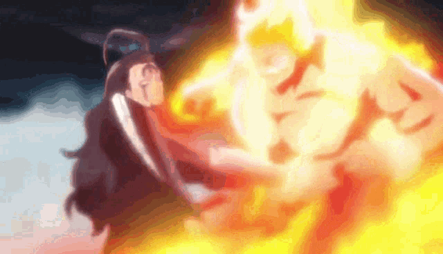 a blurry picture of a person being hit by a fire