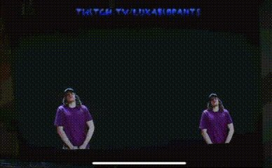 two men in purple shirts stand in front of a screen that says end of the mr blue and mr orange show
