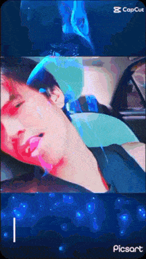 a screenshot of a man in a car with a watermark that says picsart