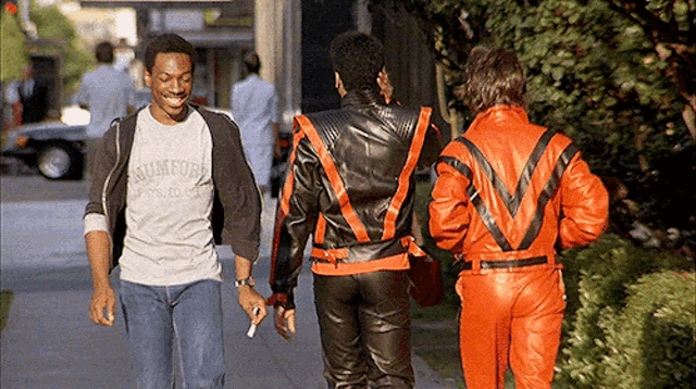 a man wearing a shirt that says sumford walks down a street