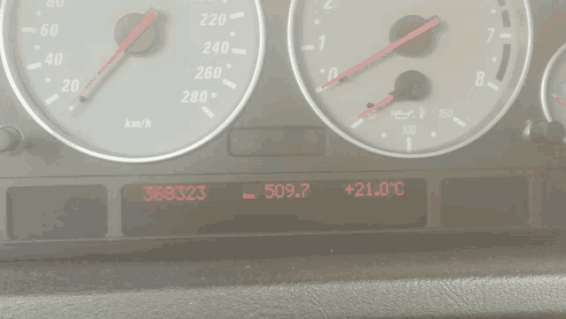 a close up of a car dashboard with the number 368323 on the screen