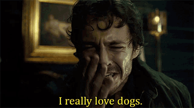a man is crying with the words i really love dogs written below him
