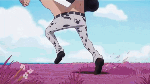 a man in dalmatian pants is running in a field of purple grass .