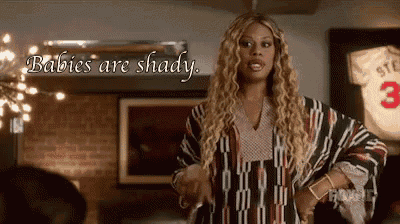 a woman says babies are shady while standing in front of a baseball jersey