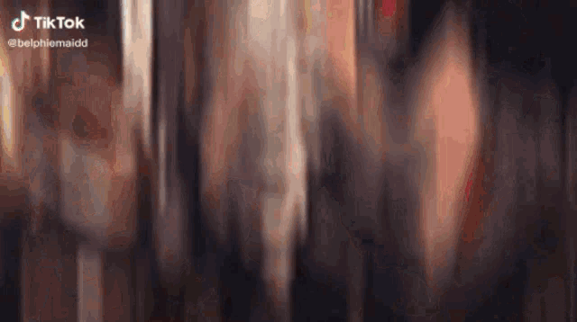 a blurred image of a person with a tiktok watermark on the bottom right