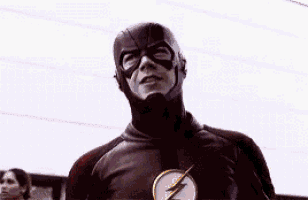 a close up of a man wearing a flash costume .