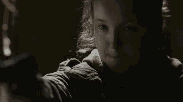 a close up of a girl 's face in the dark