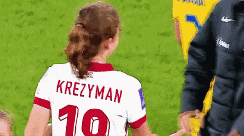 a female soccer player wearing a jersey with the number 10 on it