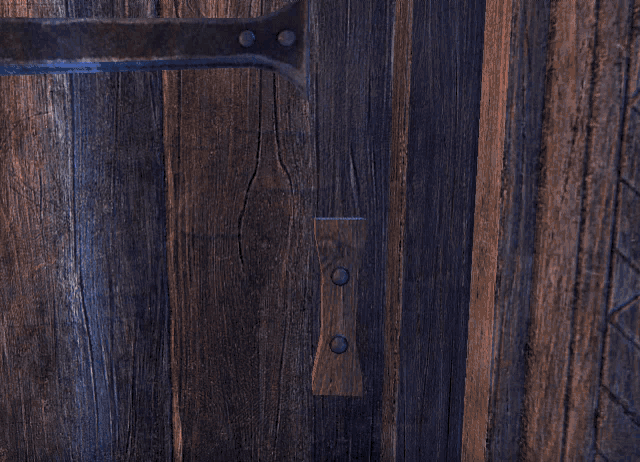 a person 's hand is reaching out to a wooden door