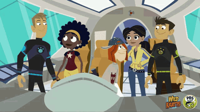 a group of cartoon characters are standing next to each other with the words wild kratts on the bottom