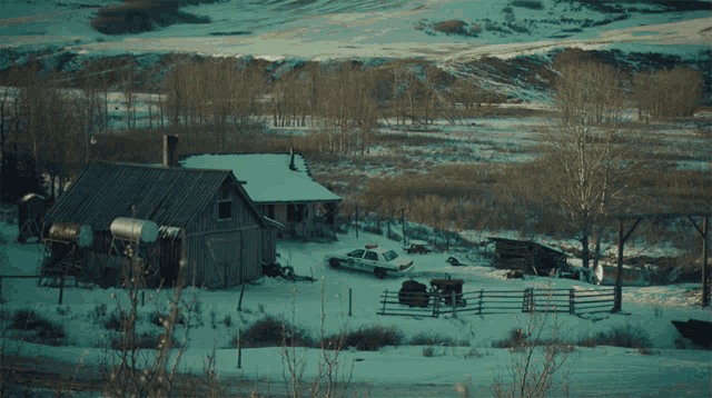 a sign that says # bring wyoming home is above a snowy house