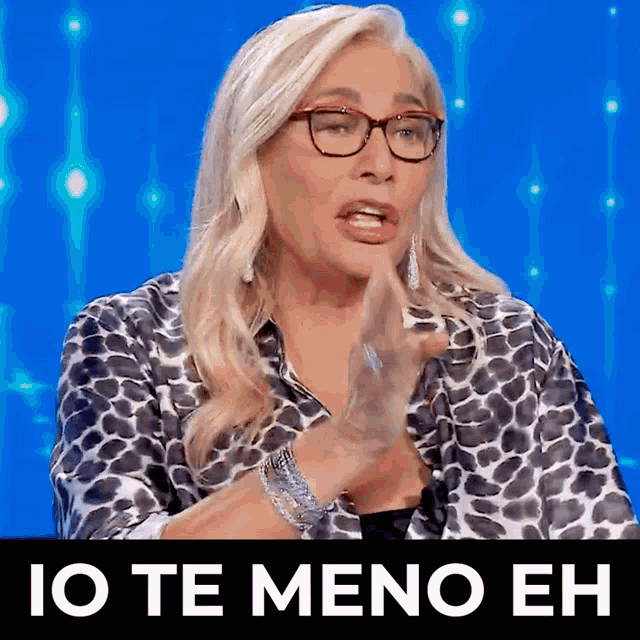 a woman wearing glasses says io te meno eh in a foreign language