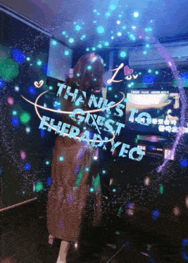 a girl is standing in front of a screen that says " thanks guest to elierahyeg "
