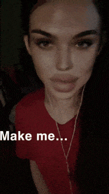 a woman in a red shirt with ear buds says make me